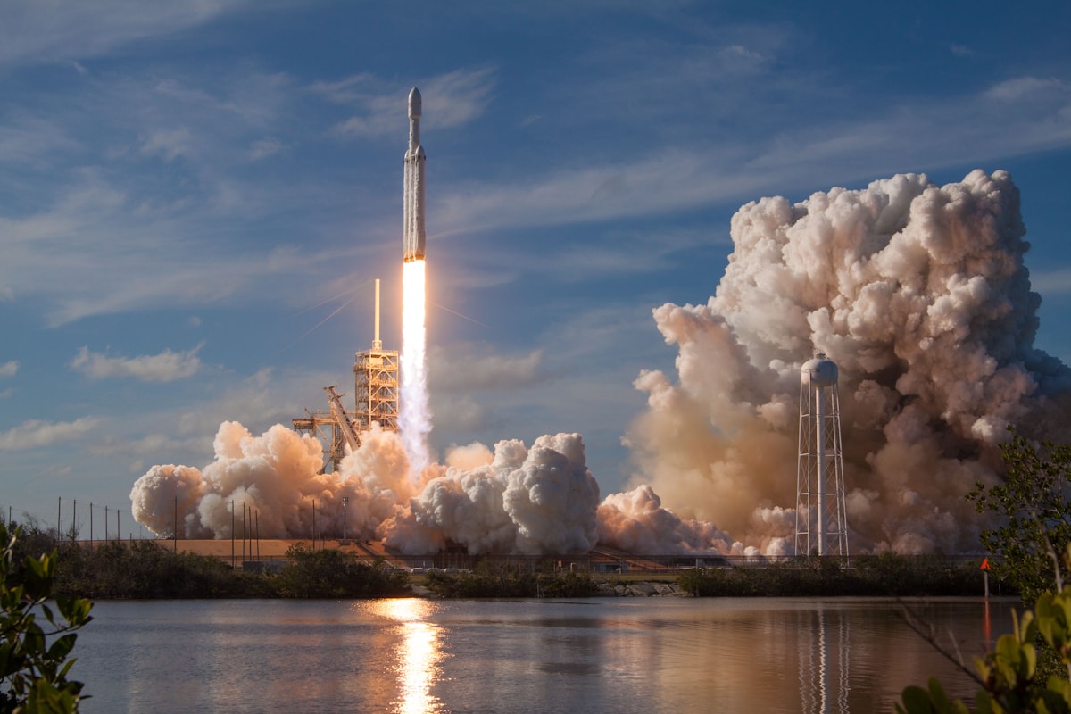 Gray spacecraft taking off, representing the SporaTek Launch Point approach to enterprise AI transformation and acceleration