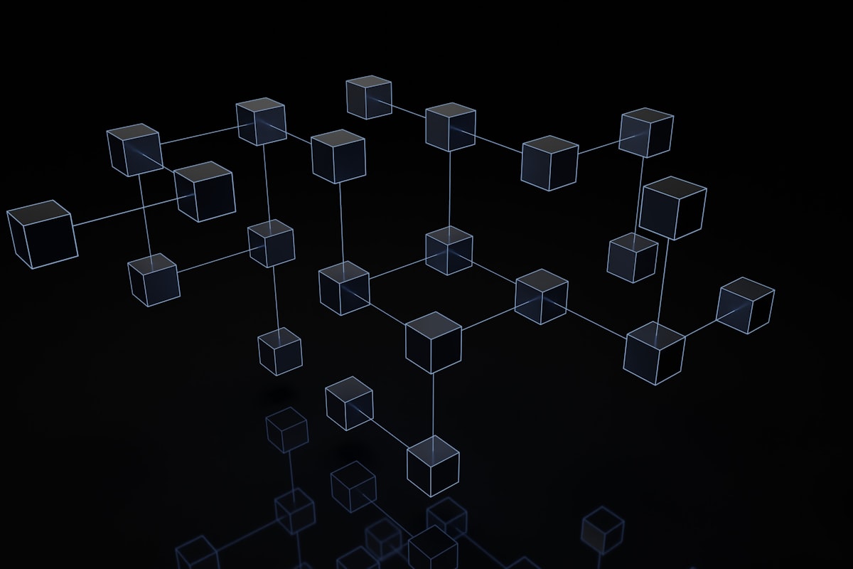A 3D render of interconnected wireframe cubes linked into a network on a black background, representing agentic workflows connecting decisions into autonomous execution